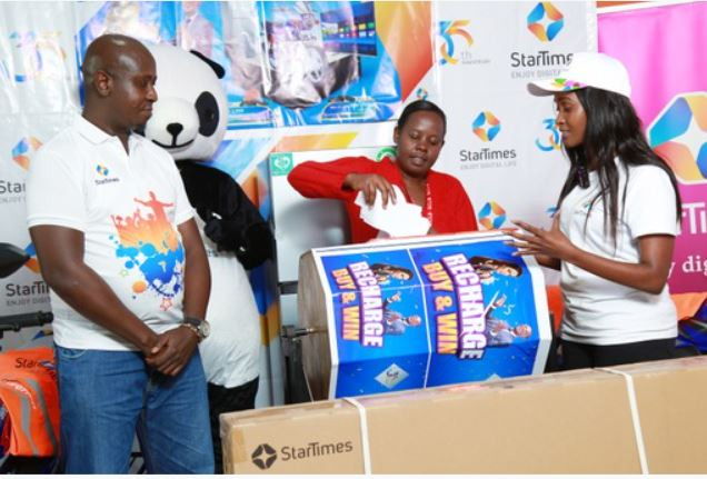 Tamima Ibrahim- Head of Business development and Marketing PANG/Startimes and Mr. Steven Ambitho during an event to unveil the winners of the Recharge Buy and Win Promotion